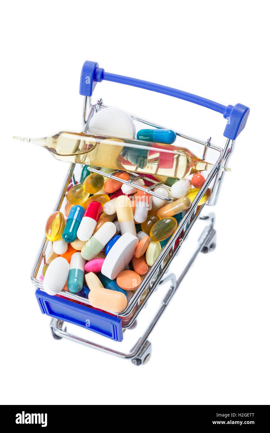 Isolated shopping cart full of medicine with pills and capsules Stock