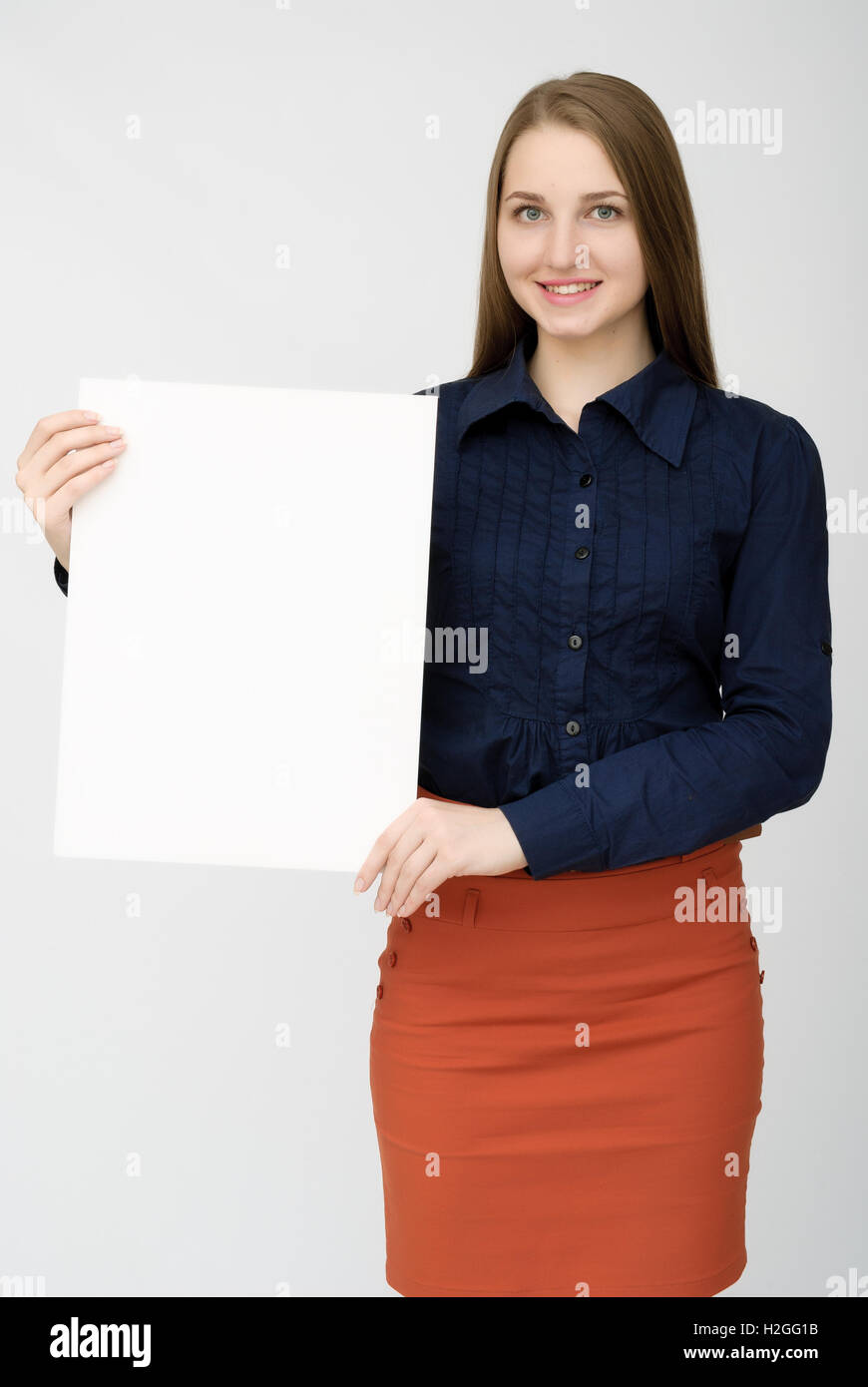 happy woman holding white blank paper Stock Photo - Alamy