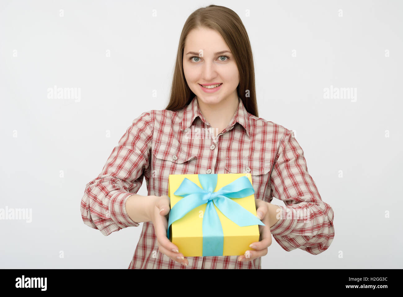 Young woman portrait holding gift Stock Photo - Alamy