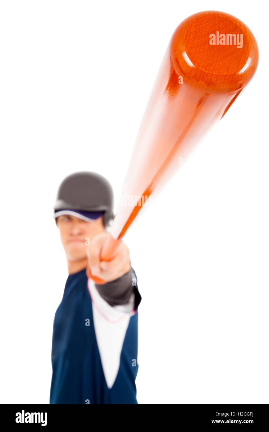 Baseball player holding bat over white