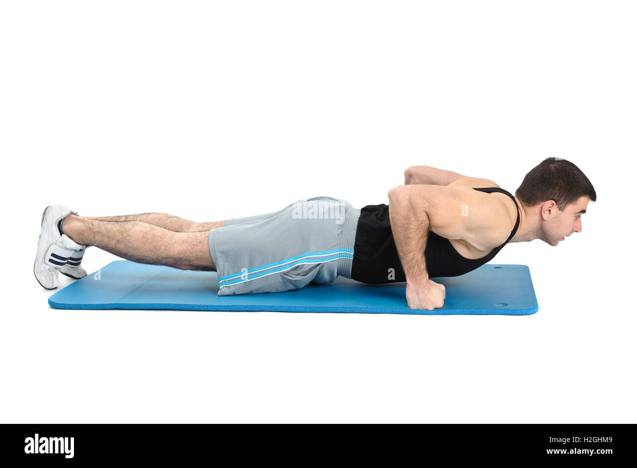 young man performing pushups exercise on fists Stock Photo Alamy