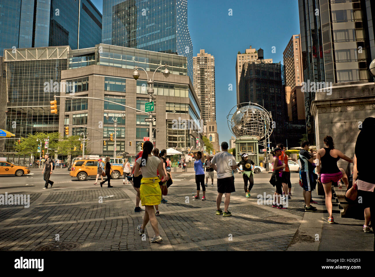 People doing fitness routine at Columbus Circle, New York Stock Photo