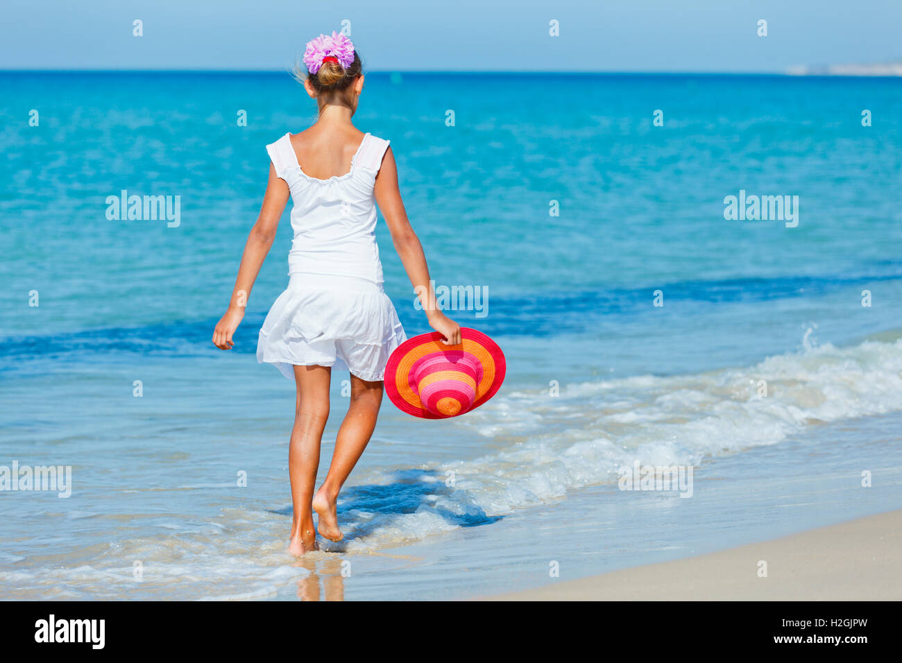 Girl with hat on the beach Stock Photo Alamy