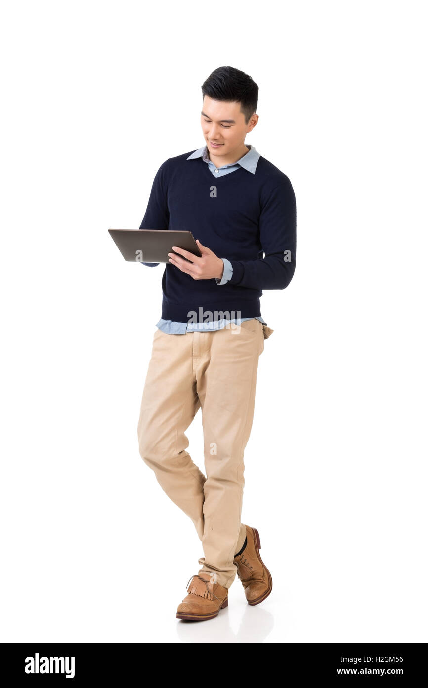Asian man using pad Stock Photo - Alamy