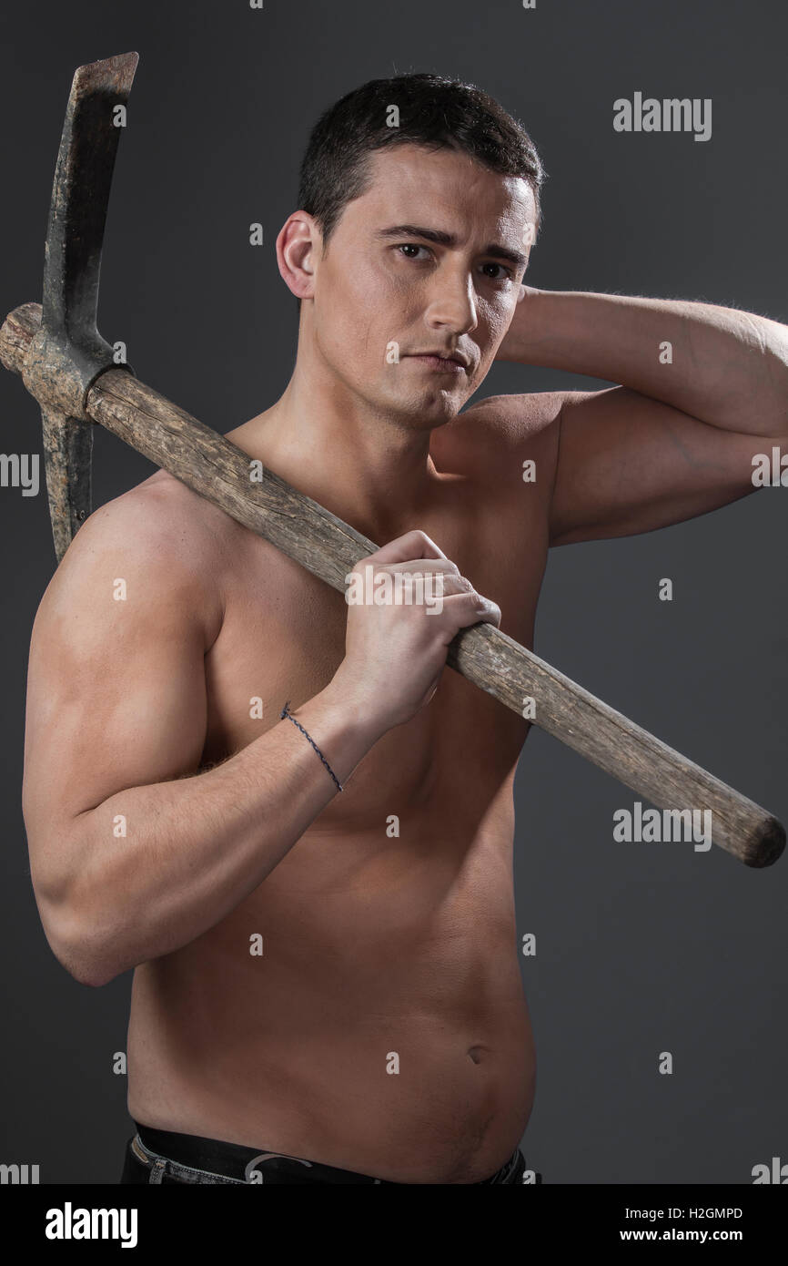 Construction worker portrait holding a peak. Stock Photo