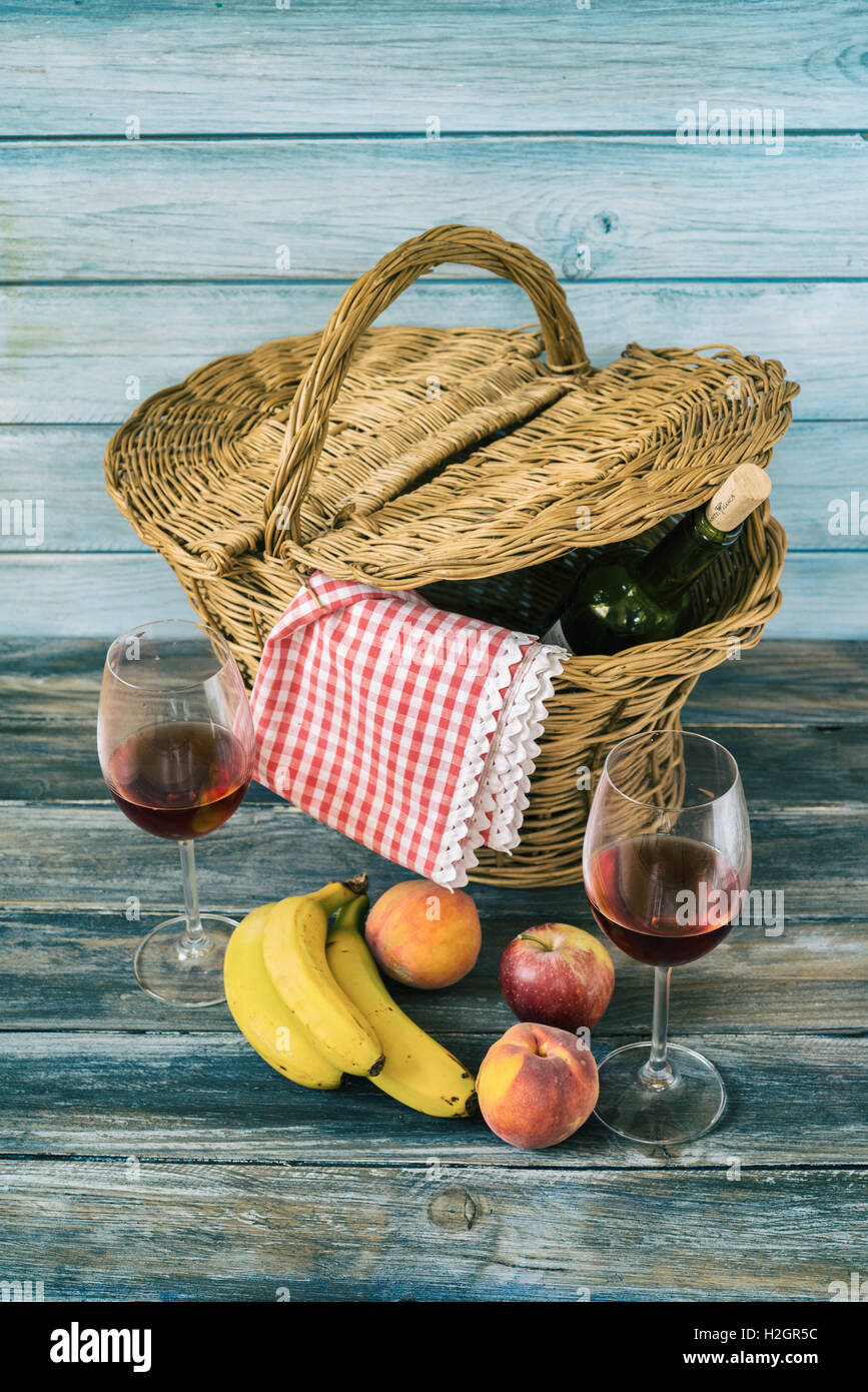 picnic basket with fresh fruit and bottle of wine Stock Photo - Alamy