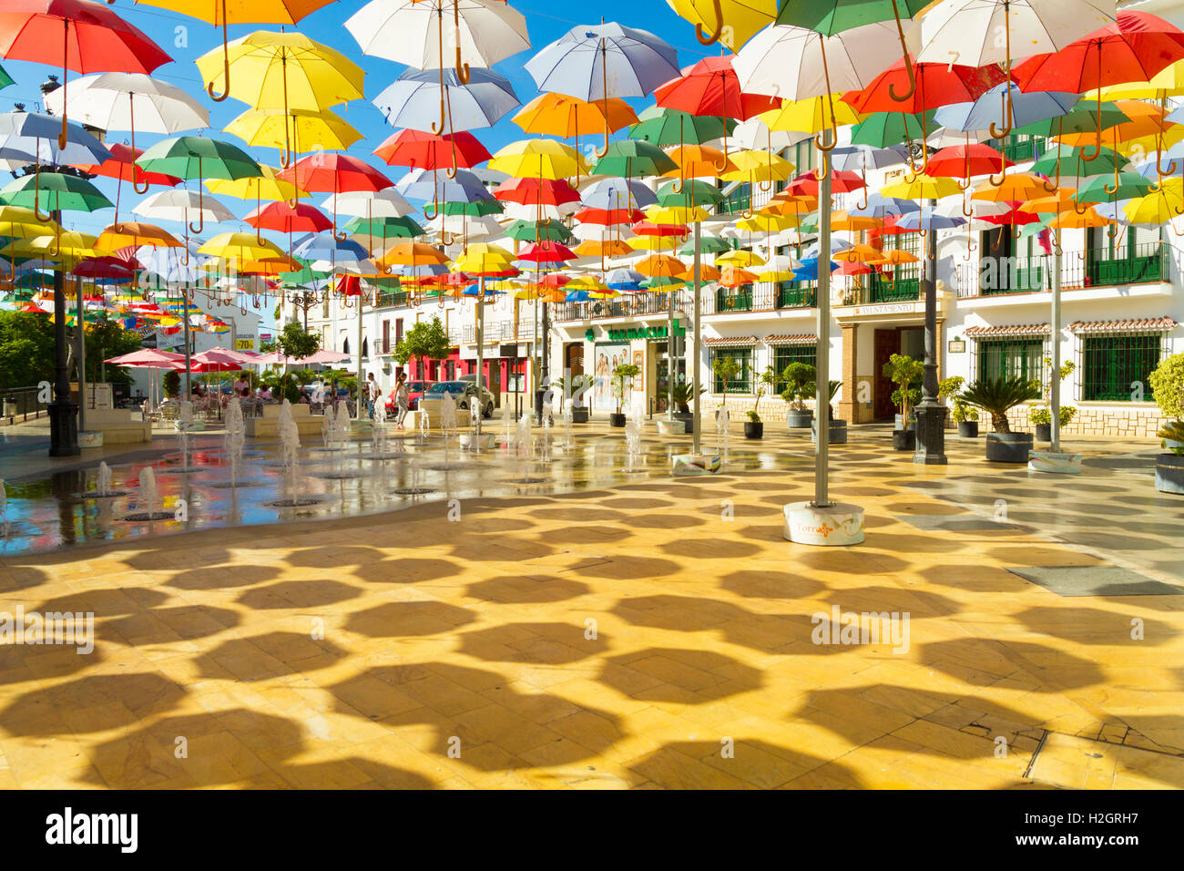 Lots of umbrellas hanging above the village square in Torrox Pueblo on