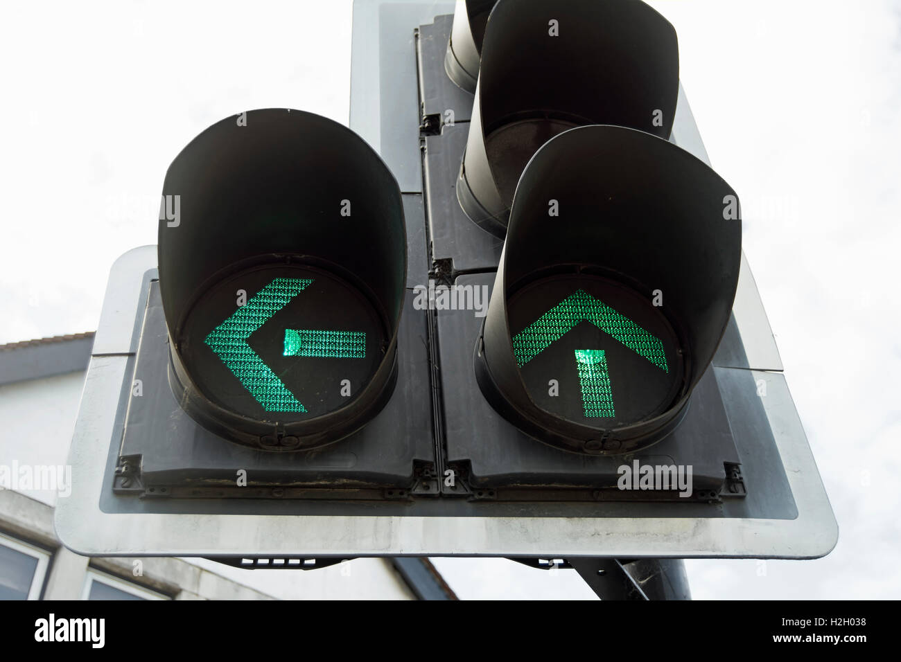 traffic lights indicating right of way for traffic turning left and moving straight ahead, at traffic lights indicating right of way for traffic turning left and moving straight ahead, at