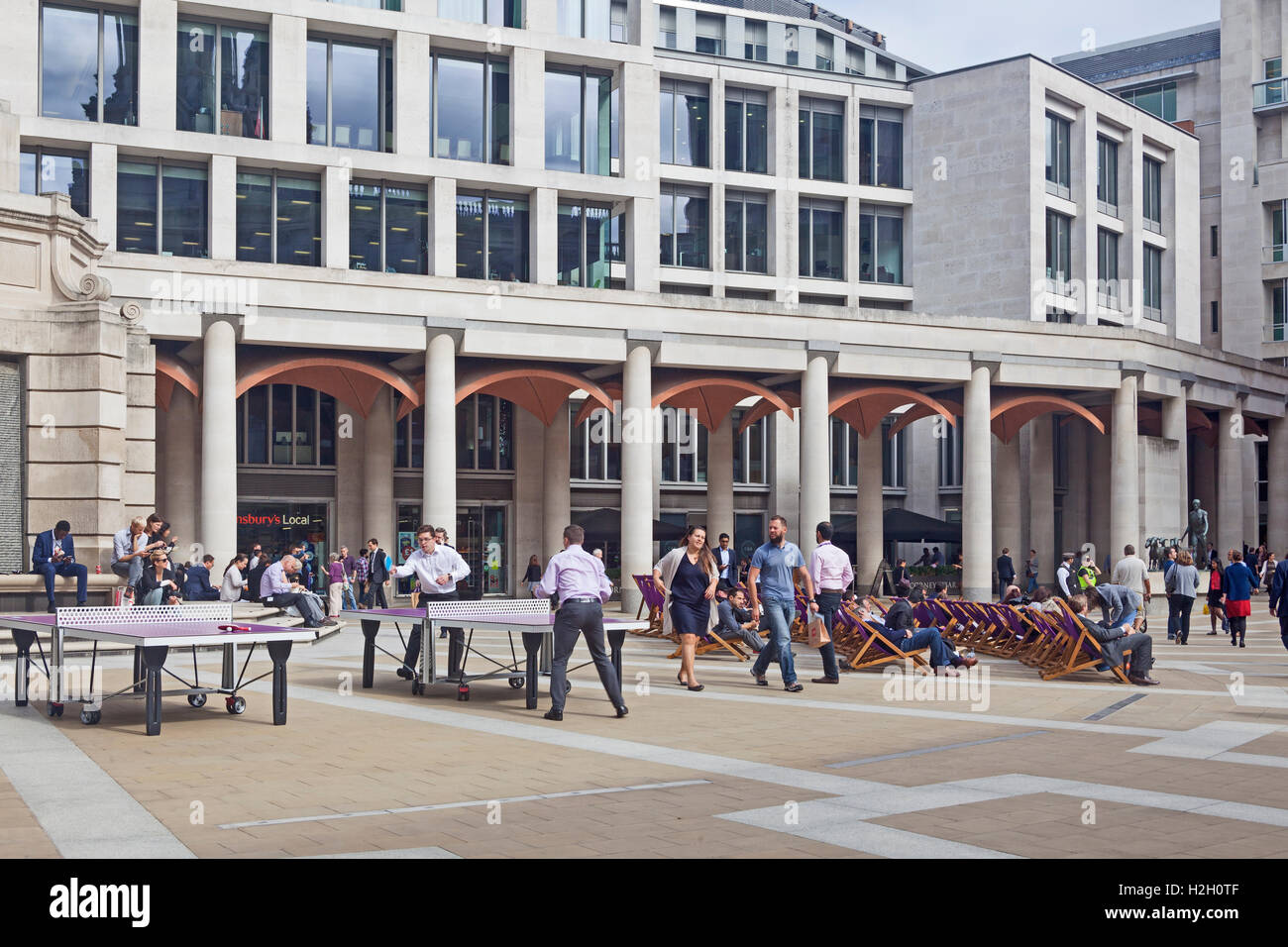 City of London  City workers and tourists at lunch-time in Paternoster Square by St Paul's Stock Photo