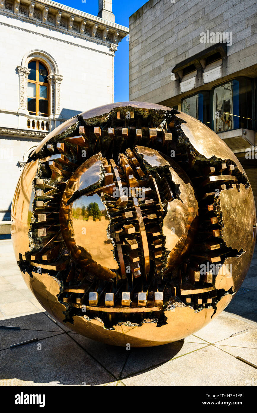 Sphere Within Sphere (Sfera con sfera) sculpture by Arnaldo Pomodoro, Trinity College Dublin, Ireland Stock Photo
