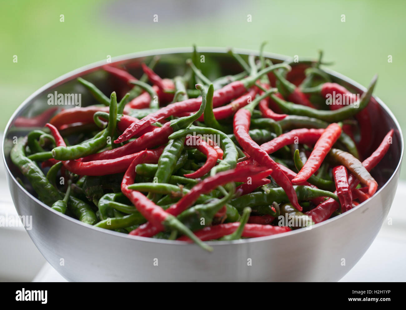 A bowl of red and green chili peppers Stock Photo Alamy