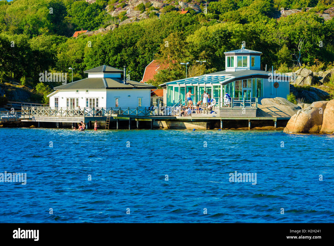 Nosund, Sweden - September 9, 2016: Real life documentary of people enjoying the warmth and sunshine at a coastal bathing house Stock Photo