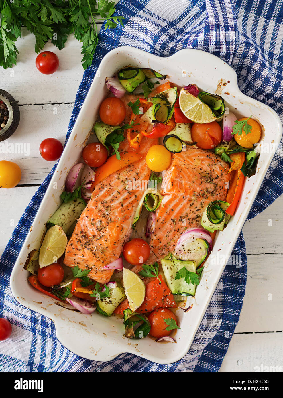 Baked salmon fillet with vegetables. Top view Stock Photo - Alamy