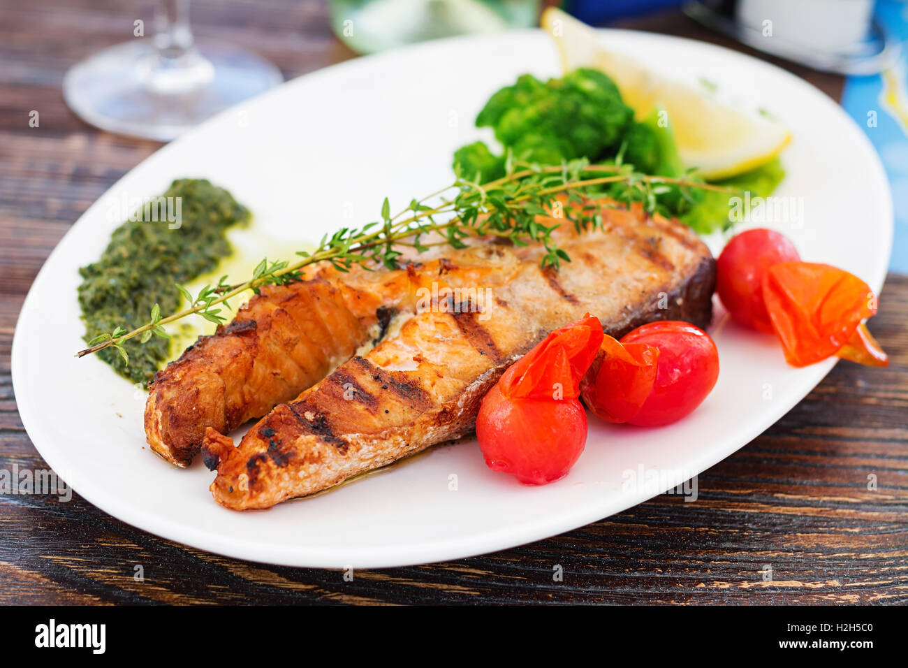 Grilled salmon steak with pesto sauce and vegetables Stock Photo Alamy