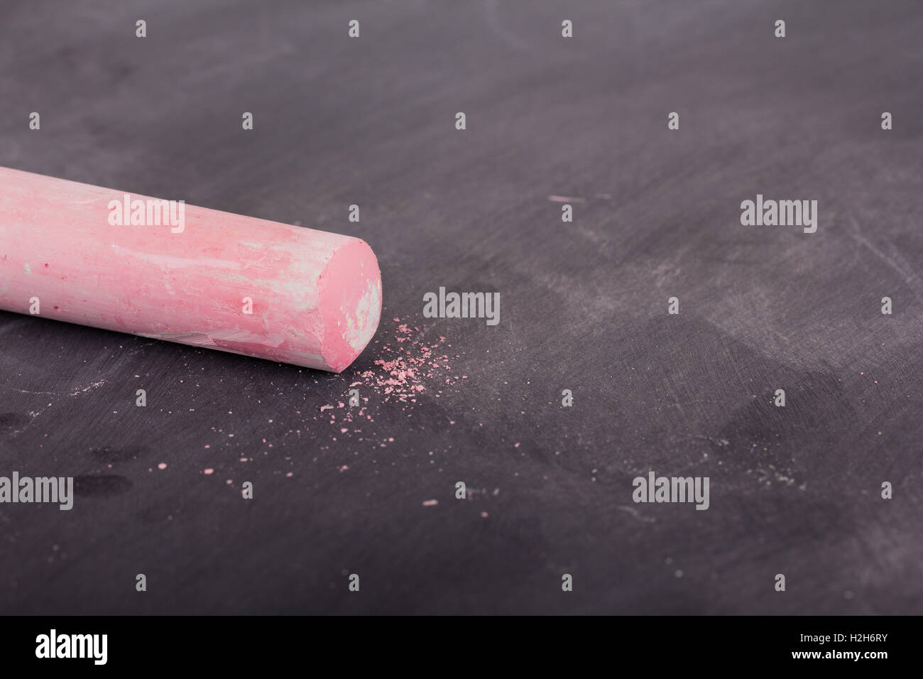 Sticks of coloured chalk on a dirty blackboard Stock Photo Alamy