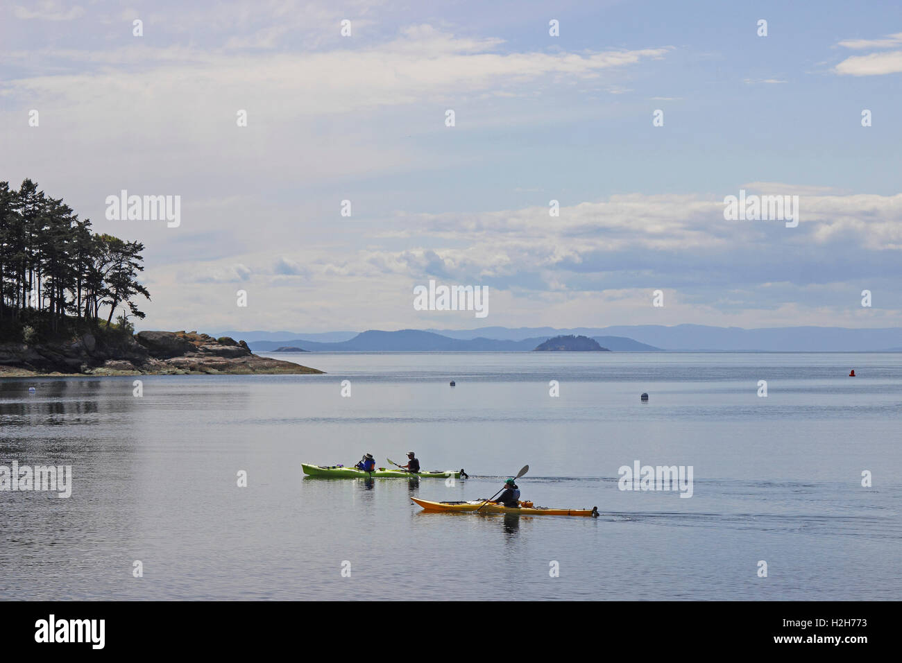 Sea kayak kayakers Sucia Island San Juan Islands Washington State USA Pacific Coast Stock Photo