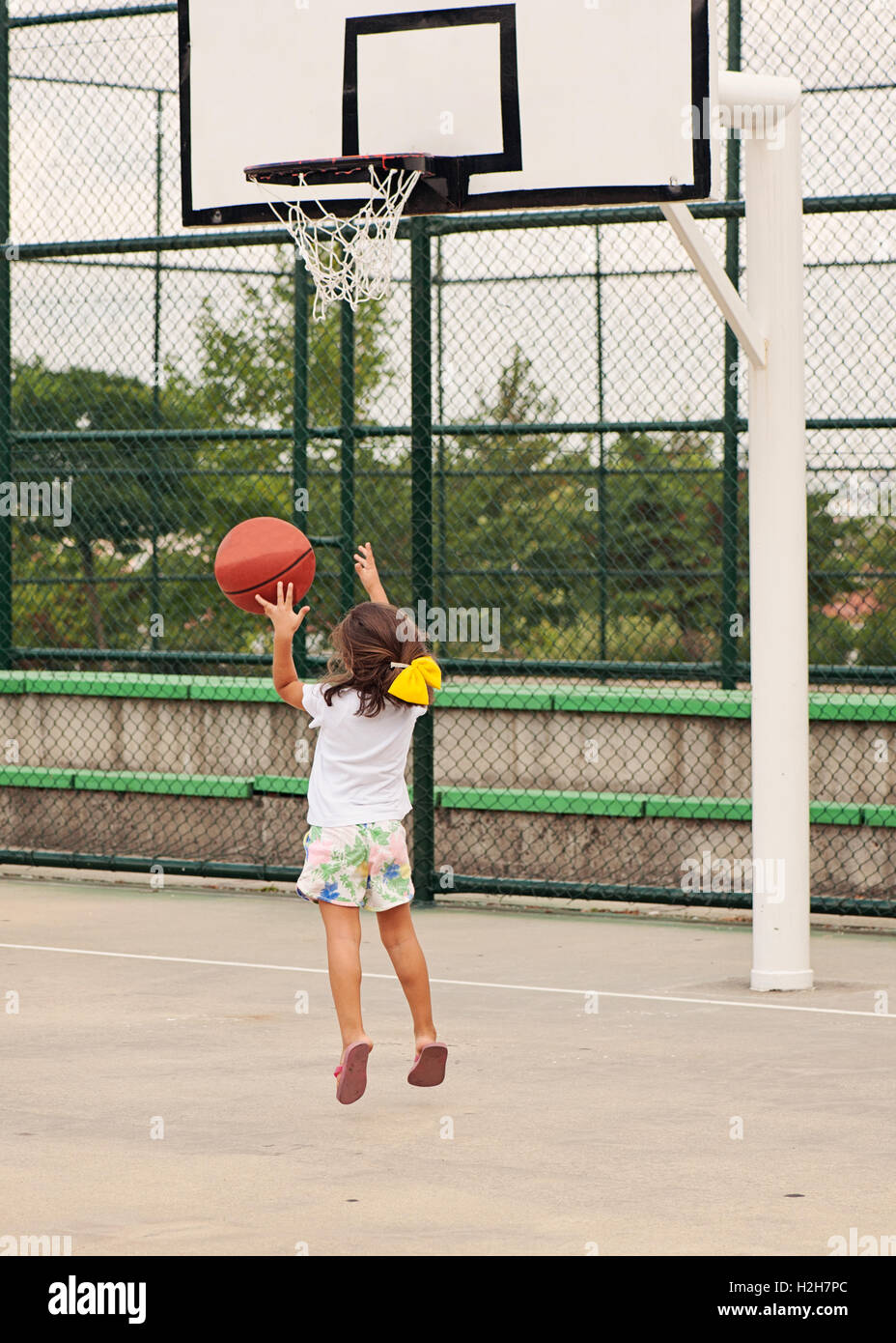 Little girl playing basketball Stock Photo Alamy