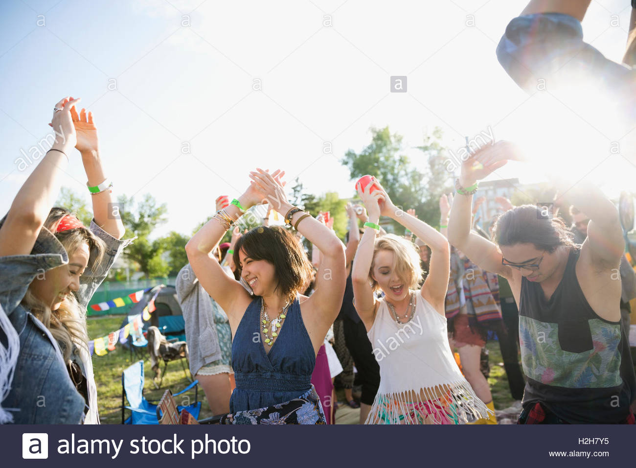 Young friends dancing at summer music festival Stock Photo - Alamy