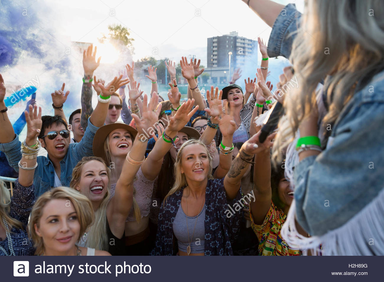 Musician waving to crowd at summer music festival Stock Photo