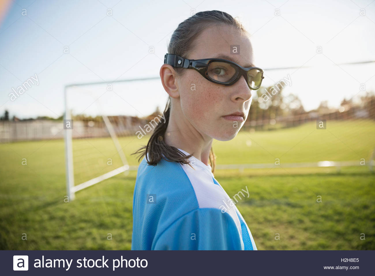 Portrait confident middle school girl soccer player wearing goggles on