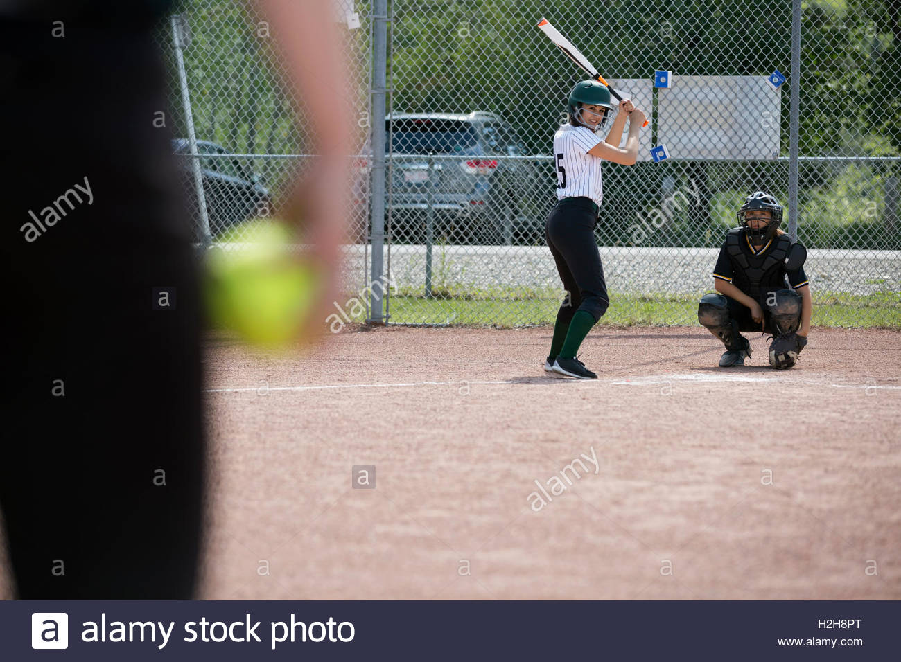 Middle school girl softball player ready to bat Stock Photo Alamy