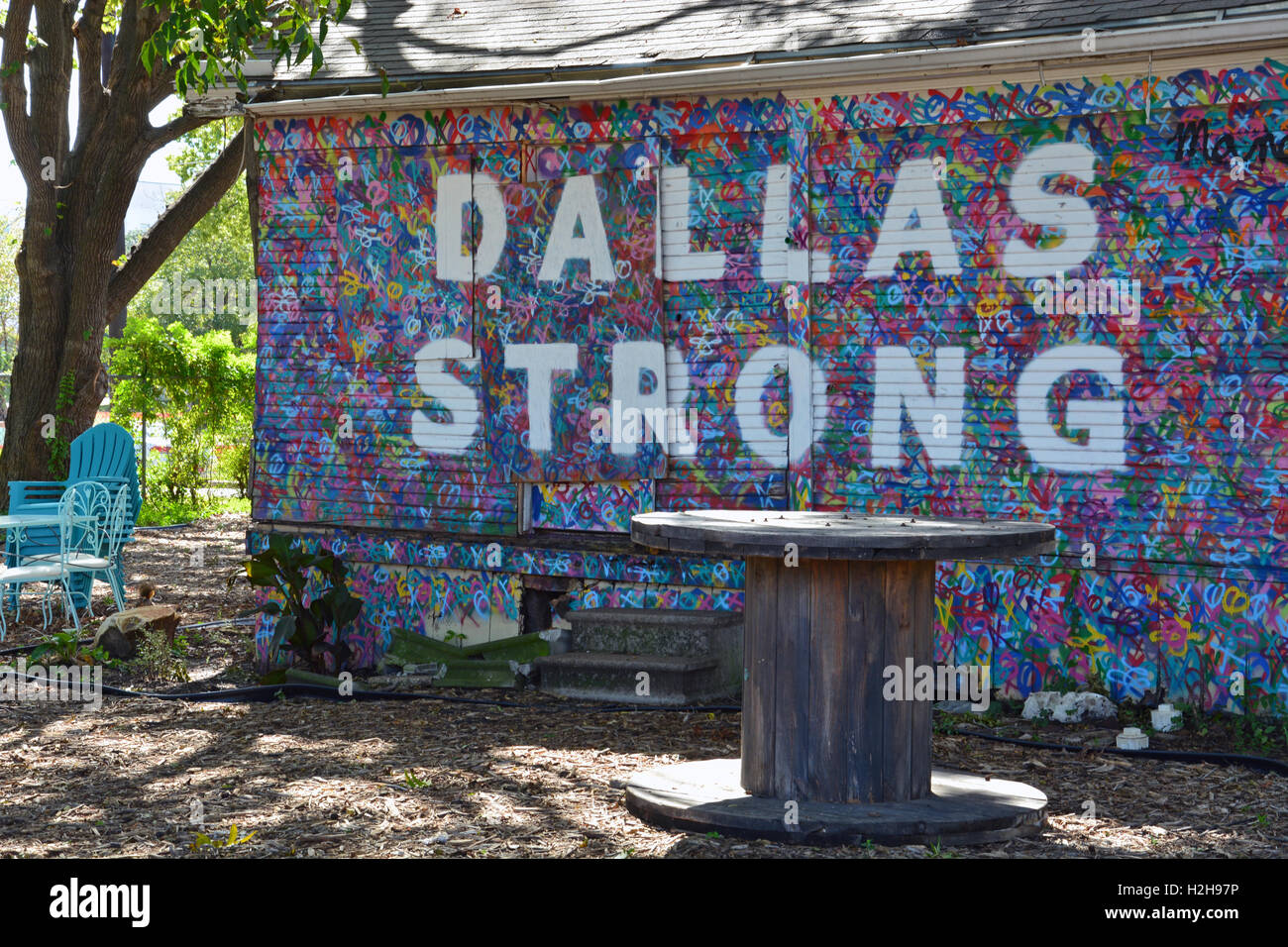 'Dallas Strong' is painted on the side of a home to support the police in the Bishop Arts District of Dallas Texas Stock Photo
