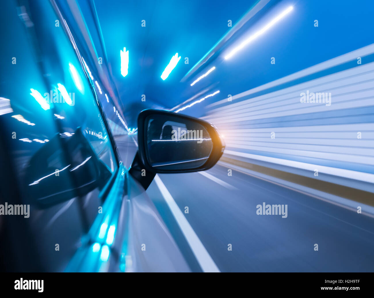 Car driving on to tunnel. Stock Photo