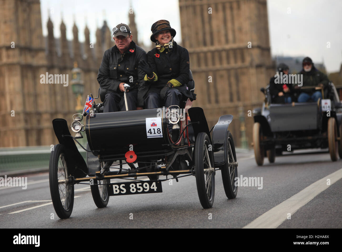Oldsmobile veteran car (1903) with The Houses of Parliament in the background during the London to Brighton veteran car run. Stock Photo