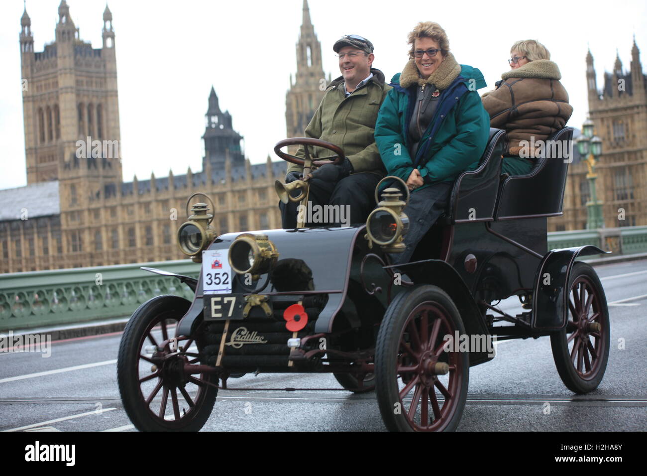 Cadillac veteran car (1904) with The Houses of Parliament in the background during the London to Brighton veteran car run. Stock Photo