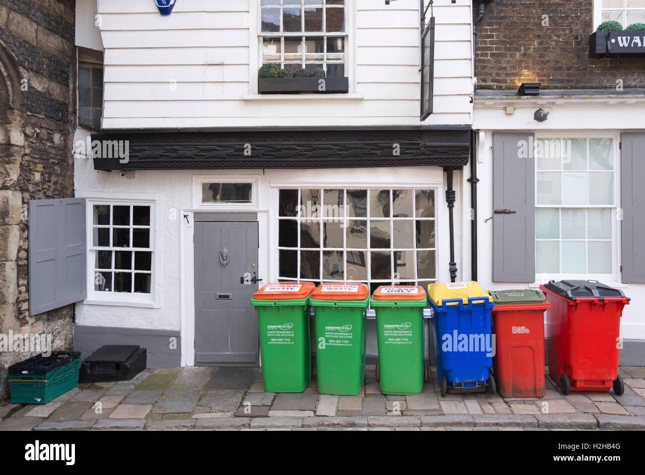 Bins for waste and recycling left outside of old buildings, Rochester