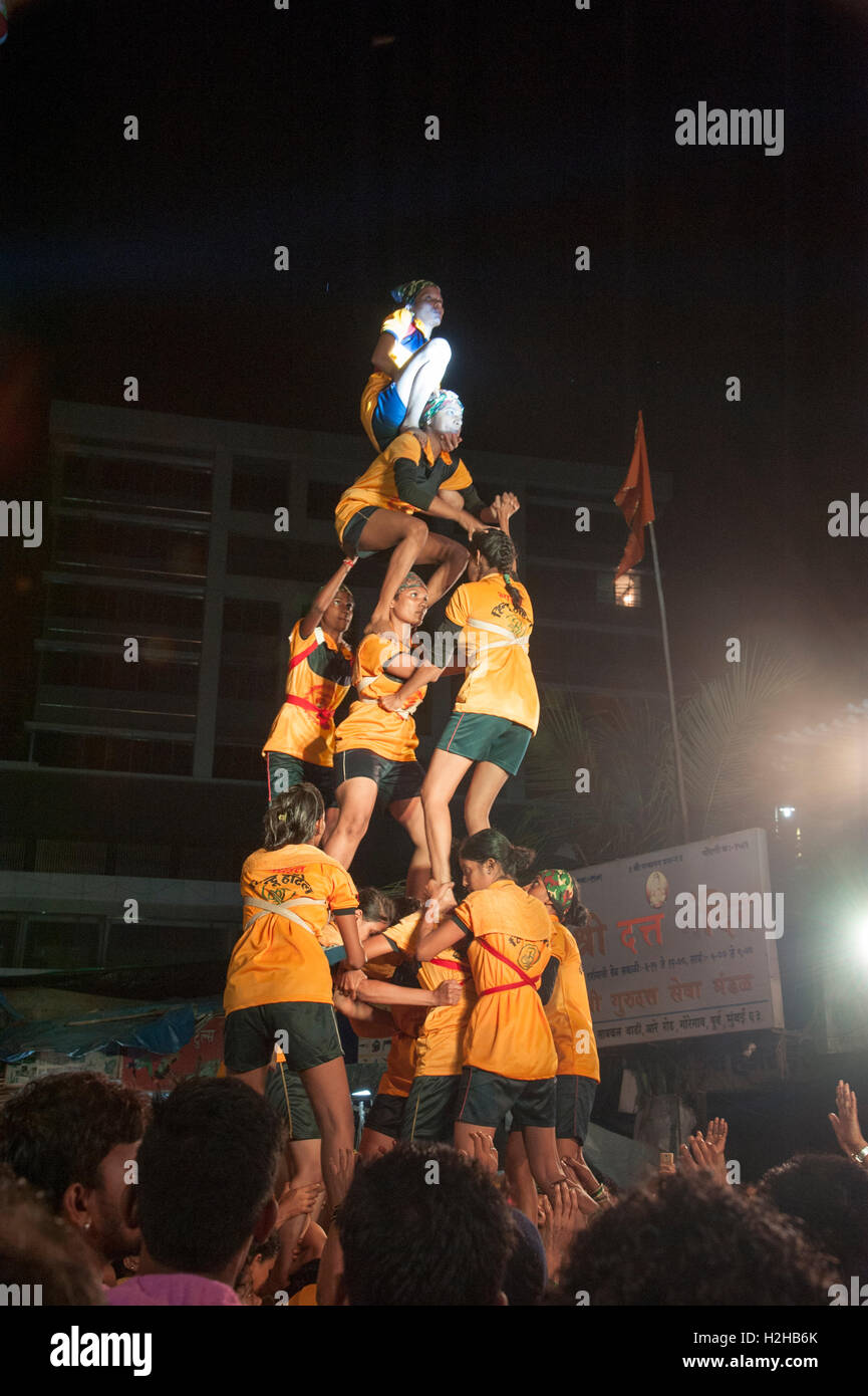 Devotees form a Mahila Govinda - Women Pyramid   to break the  Dahi handi   as part of celebrations to Janmashtami mumbai india Stock Photo