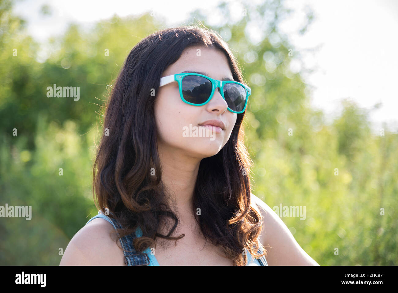 Portrait of beautiful teen girl in sunglasses Stock Photo - Alamy