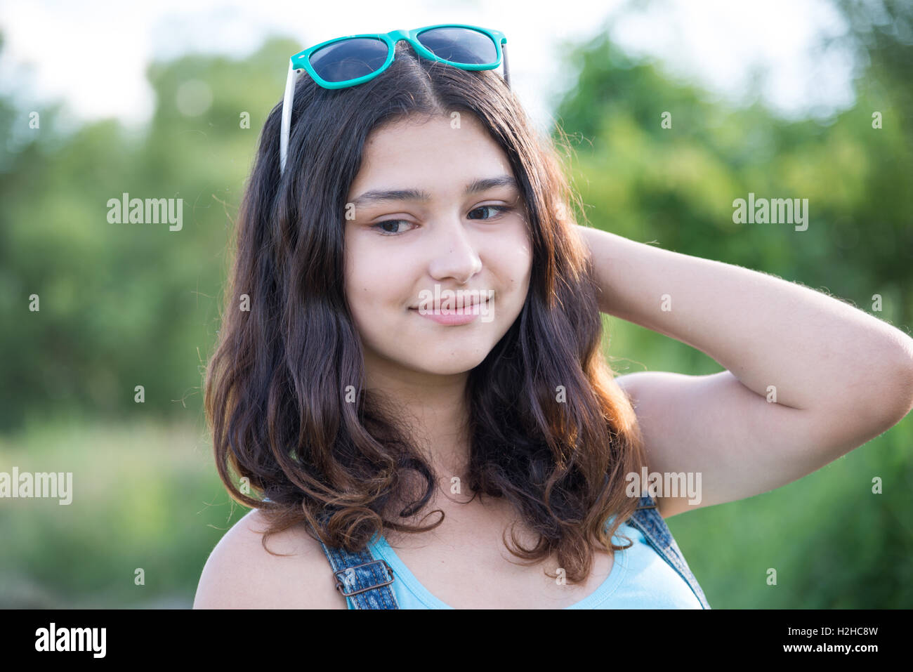 Portrait of beautiful teen girl with sunglasses on head Stock Photo - Alamy