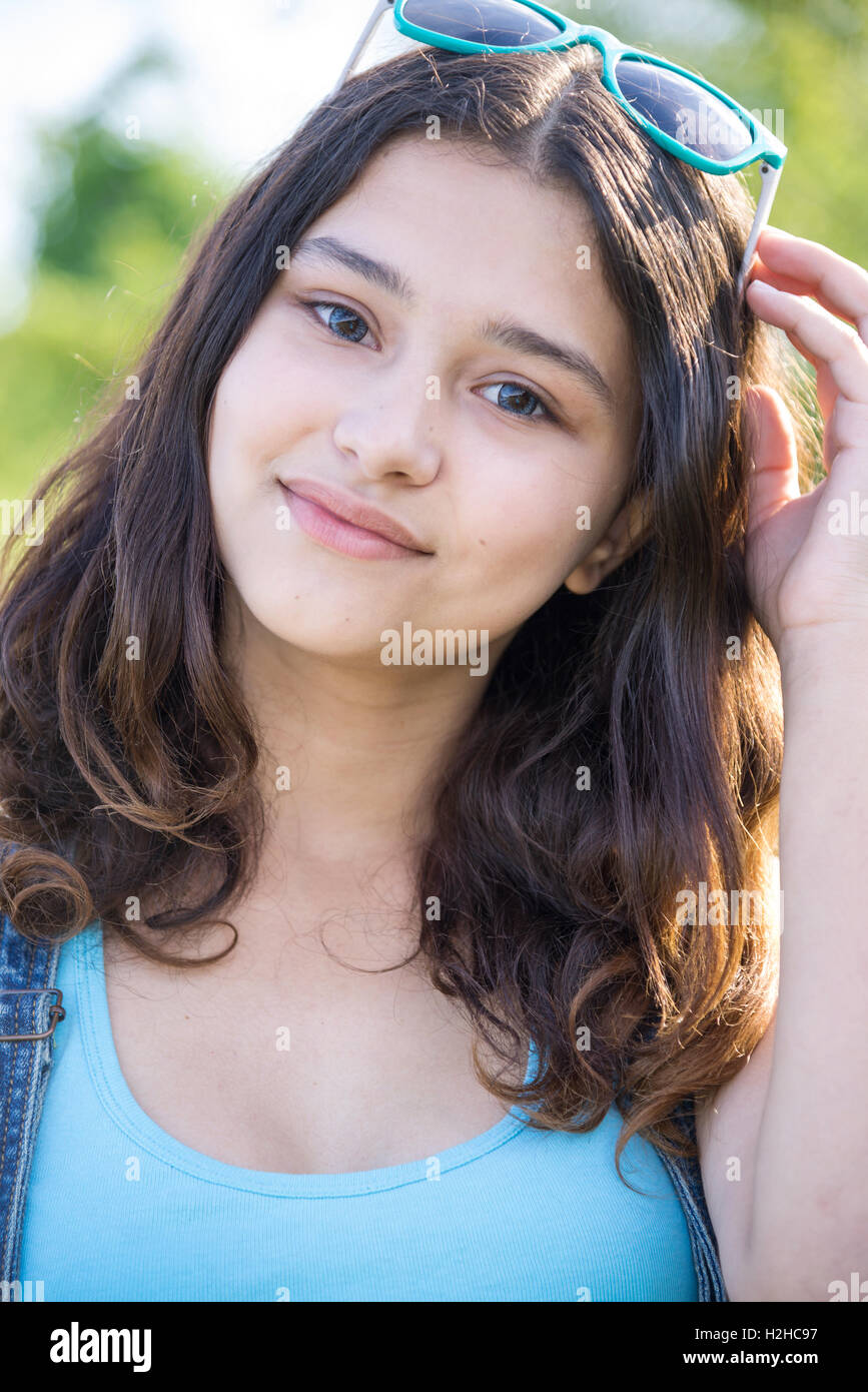 Portrait of beautiful teen girl with sunglasses on head Stock Photo - Alamy