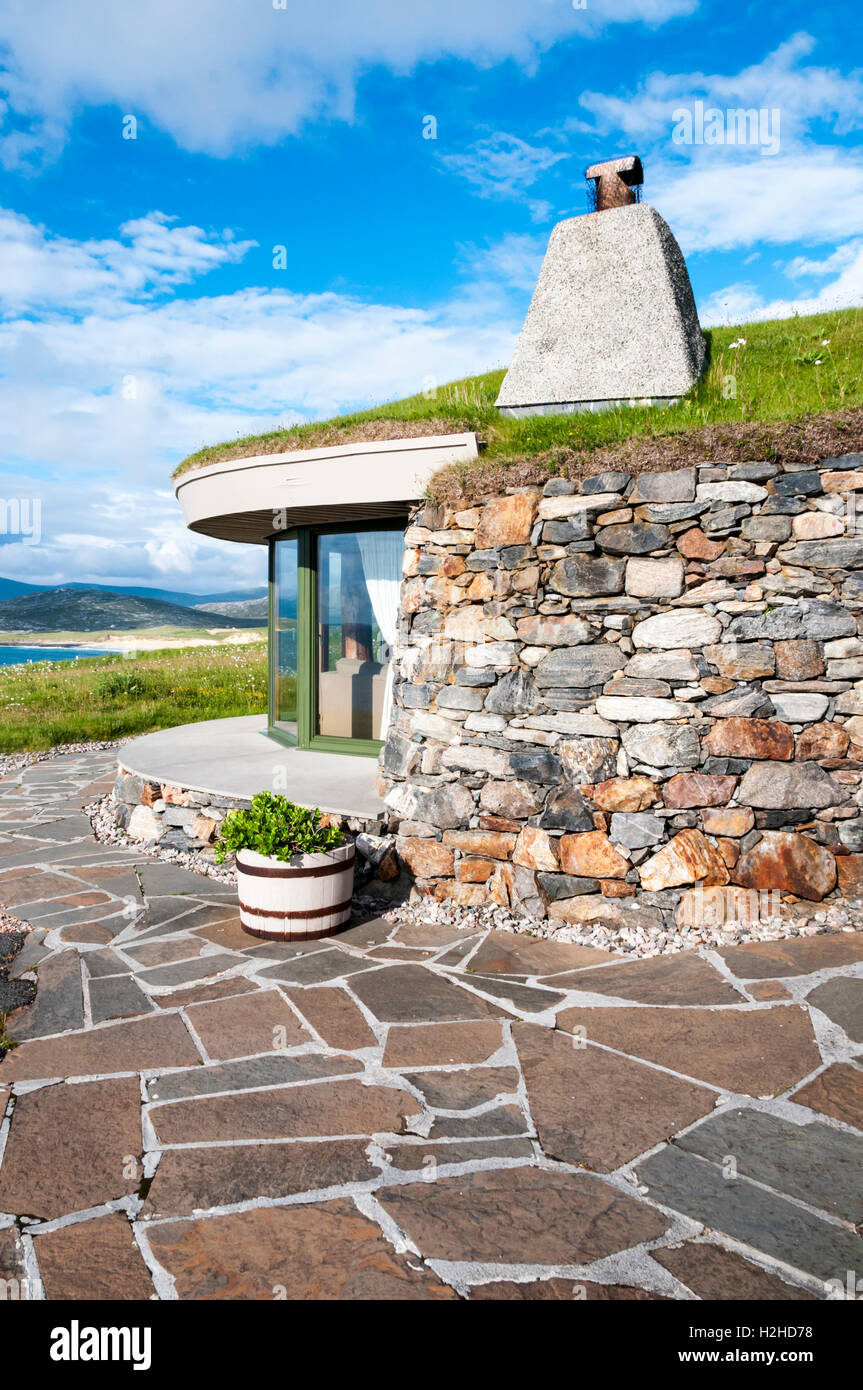Low-profile grass-roofed house at Scarista on the Isle of Harris, overlooking Taransay & the Sound of Harris in Outer Hebrides. Stock Photo