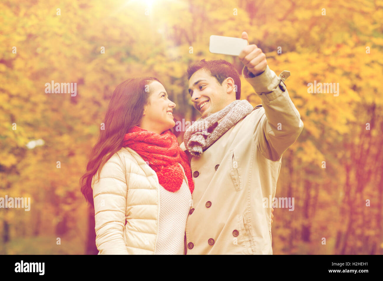 smiling couple hugging in autumn park Stock Photo - Alamy