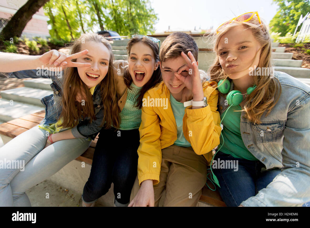 happy teenage students or friends having fun Stock Photo - Alamy