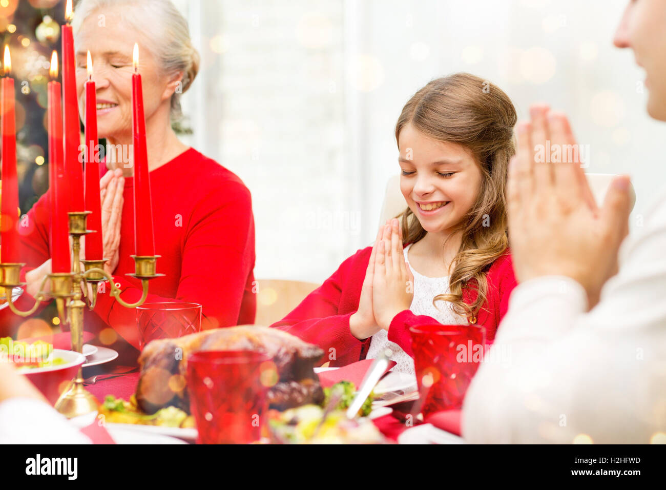 smiling family having holiday dinner at home Stock Photo - Alamy