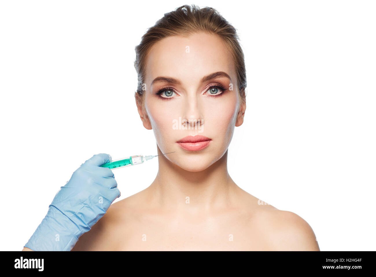 woman face and hand with syringe making injection Stock Photo - Alamy