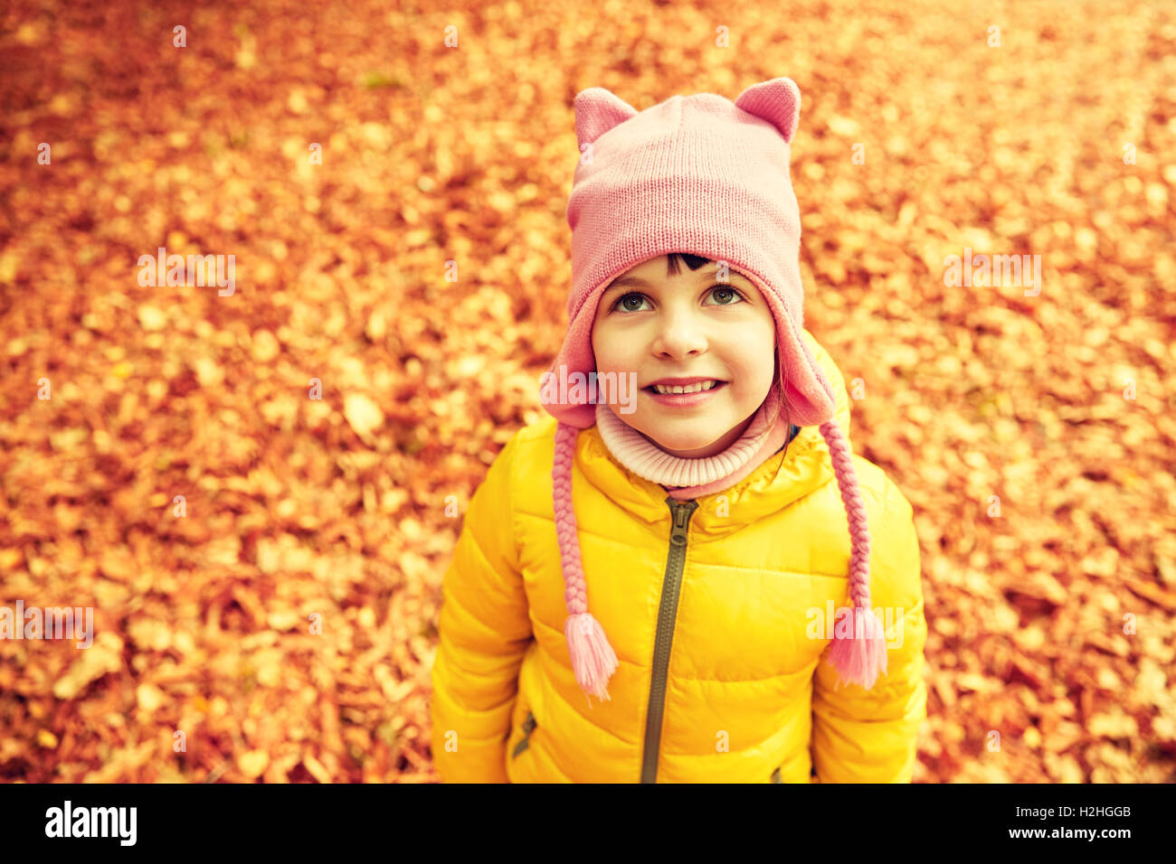 happy little girl in autumn park Stock Photo - Alamy
