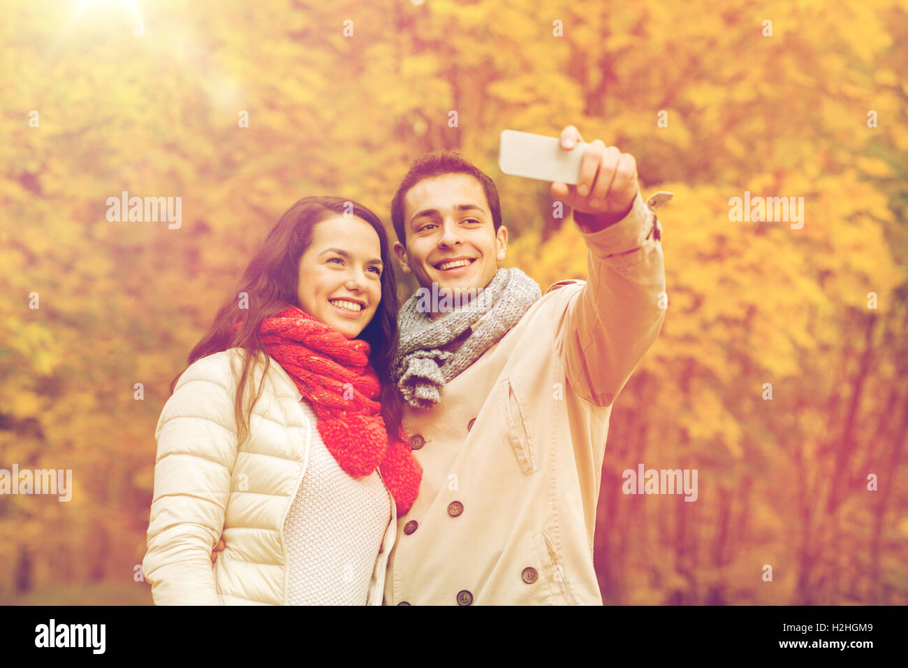 smiling couple hugging in autumn park Stock Photo - Alamy