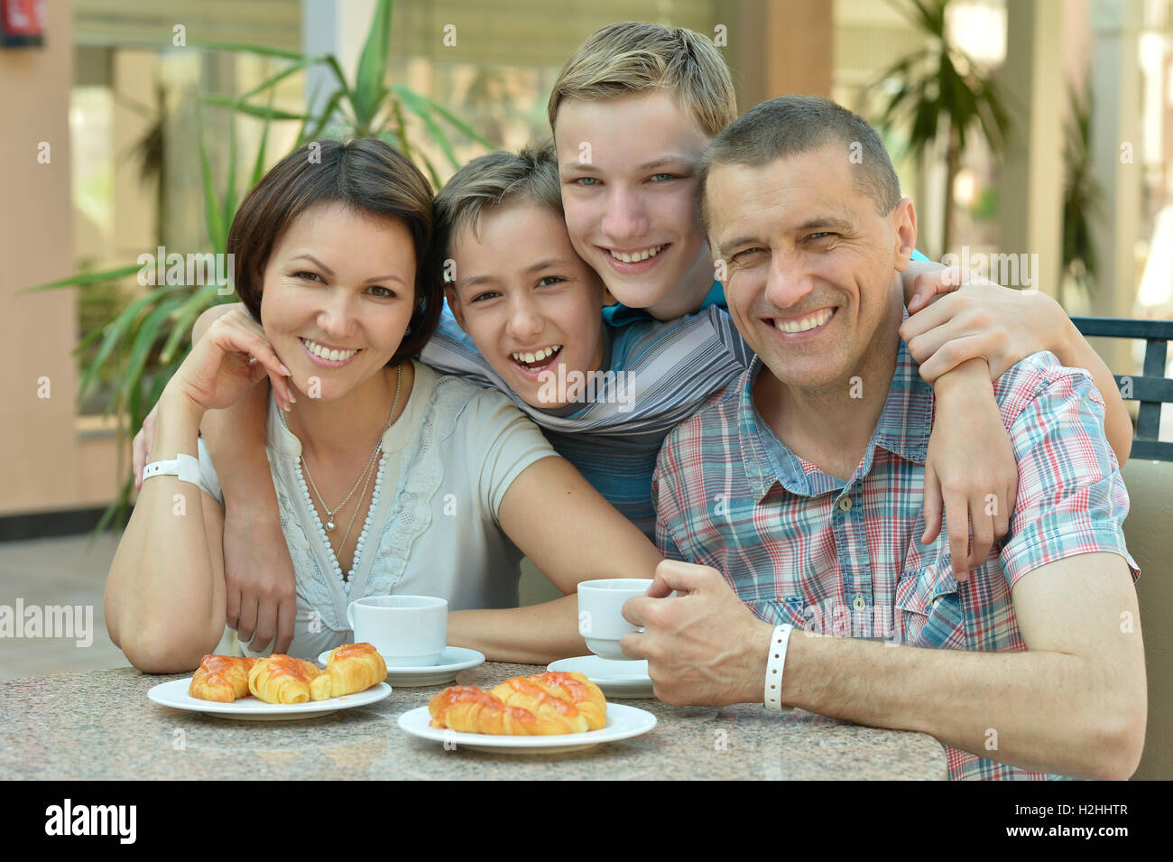 Happy family at breakfast Stock Photo - Alamy