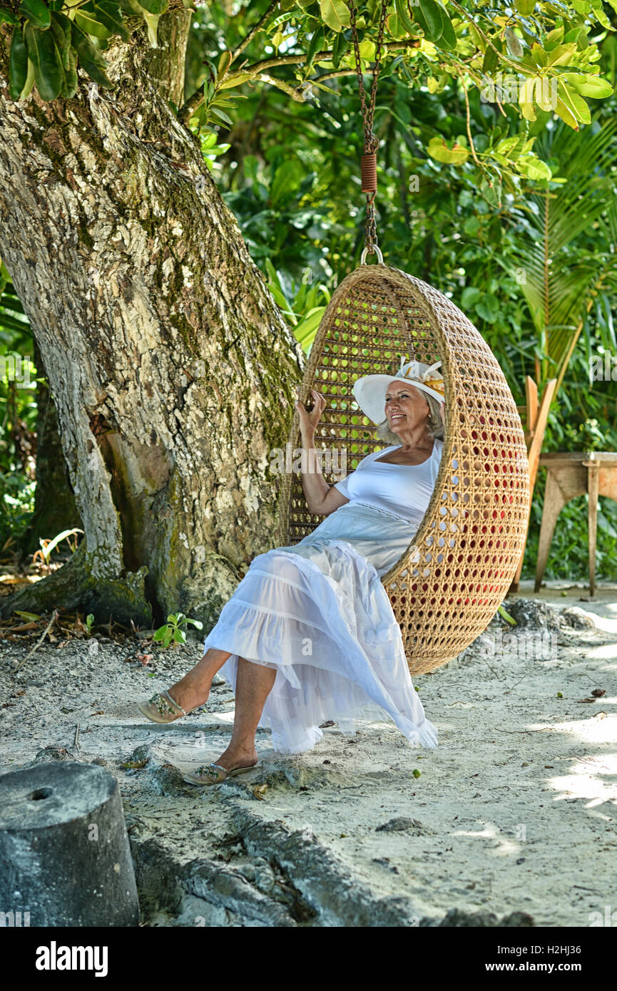 Beautiful happy mature woman swing hi-res stock photography and images ...