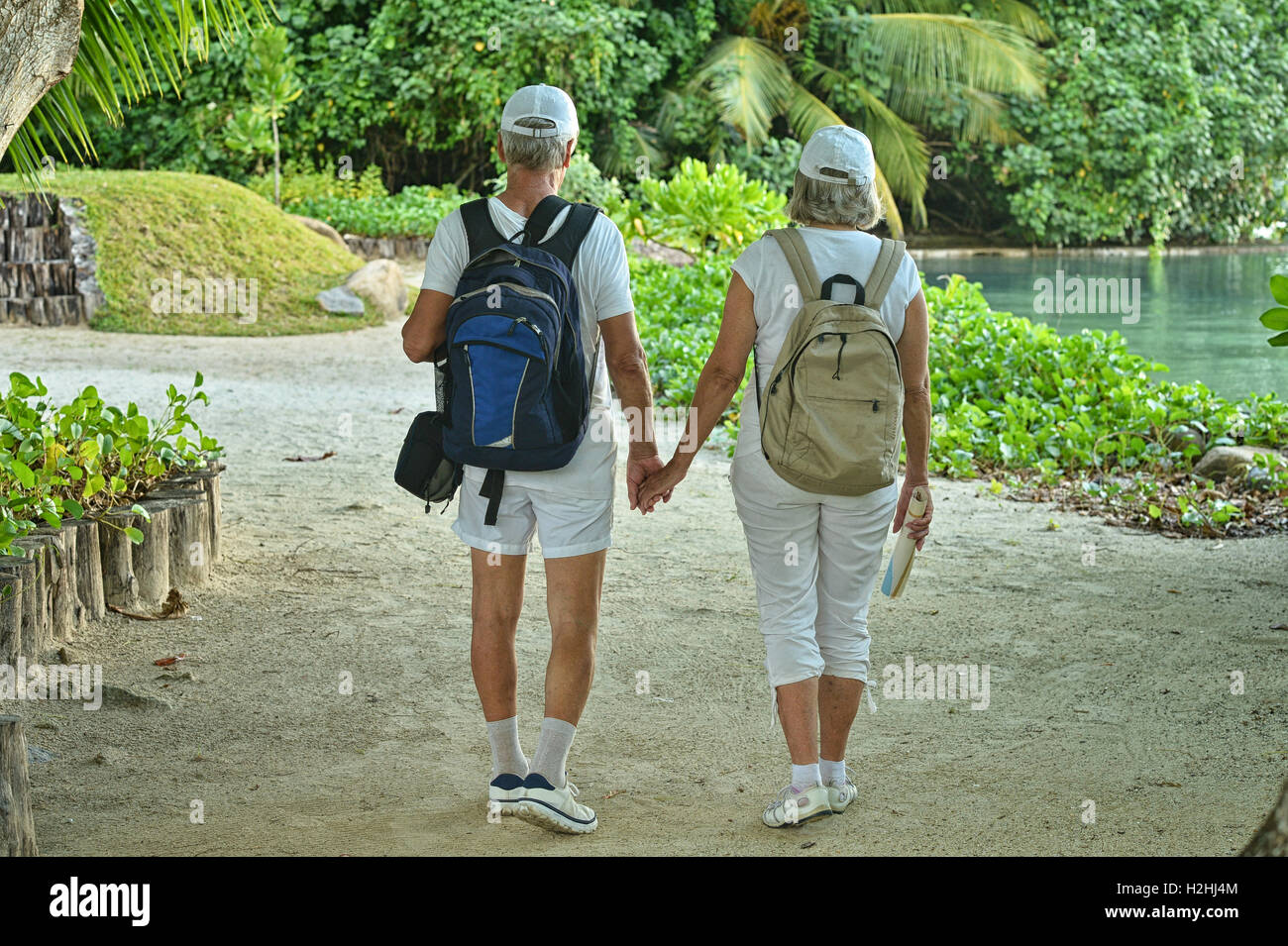 elderly couple with backpacks Stock Photo