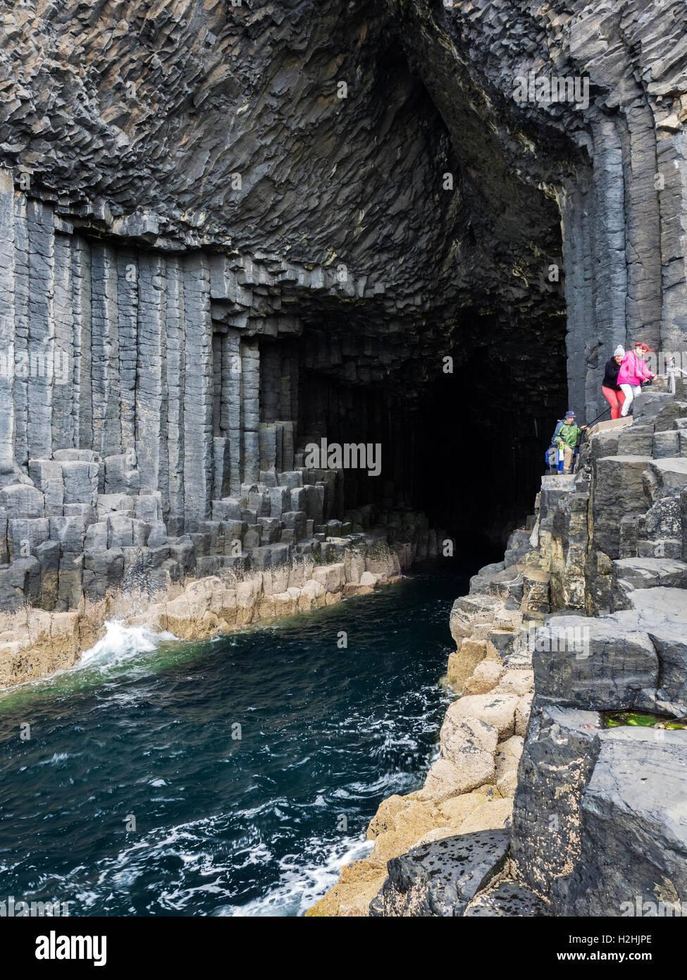 People Leaving the Mouth of Fingals Cave on the Isle of Staffa Argyll and Bute Scotland Stock Photo