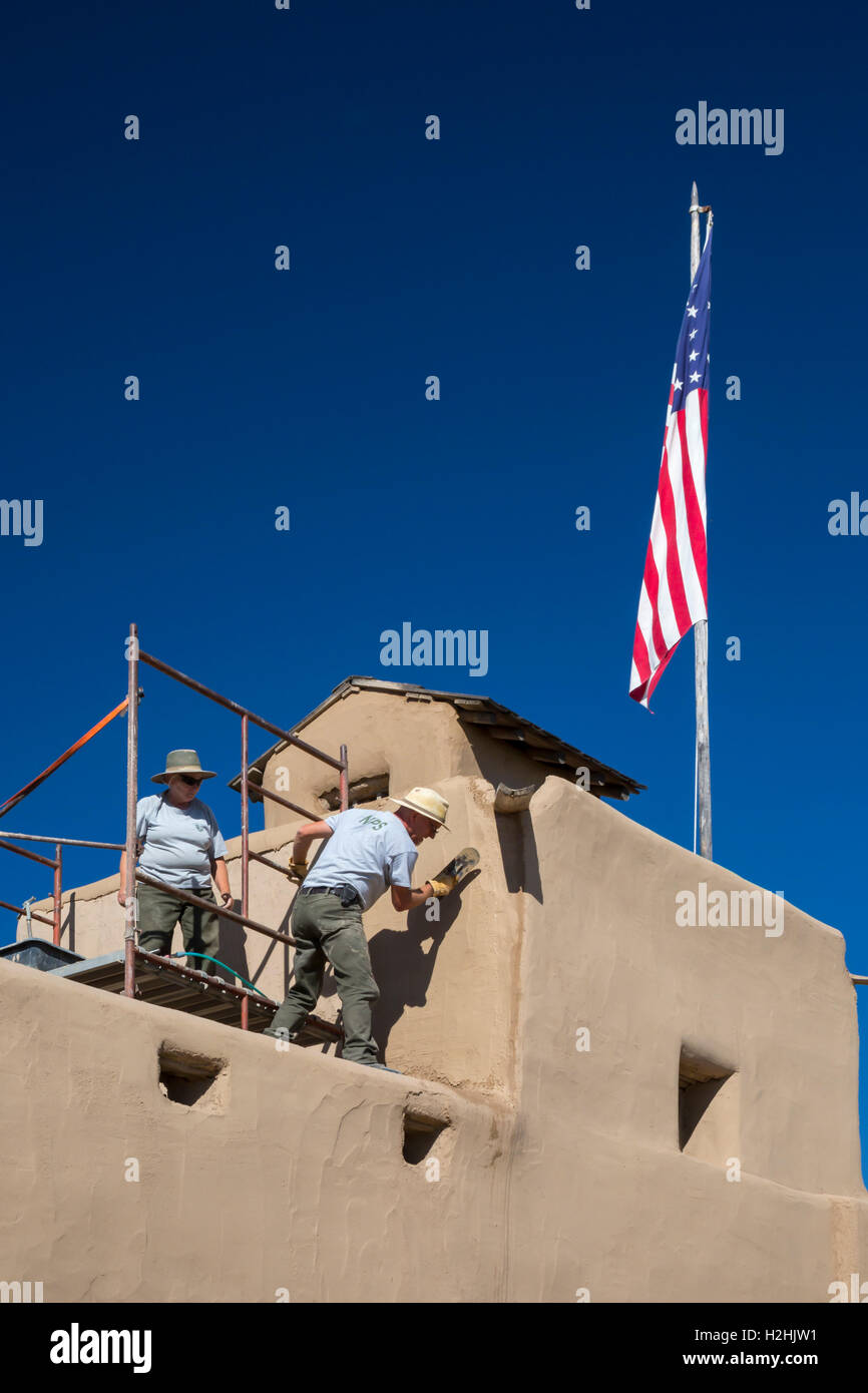 La Junta, Colorado - Bent's Old Fort National Historic Site. Workers repair the adobe fort. Stock Photo