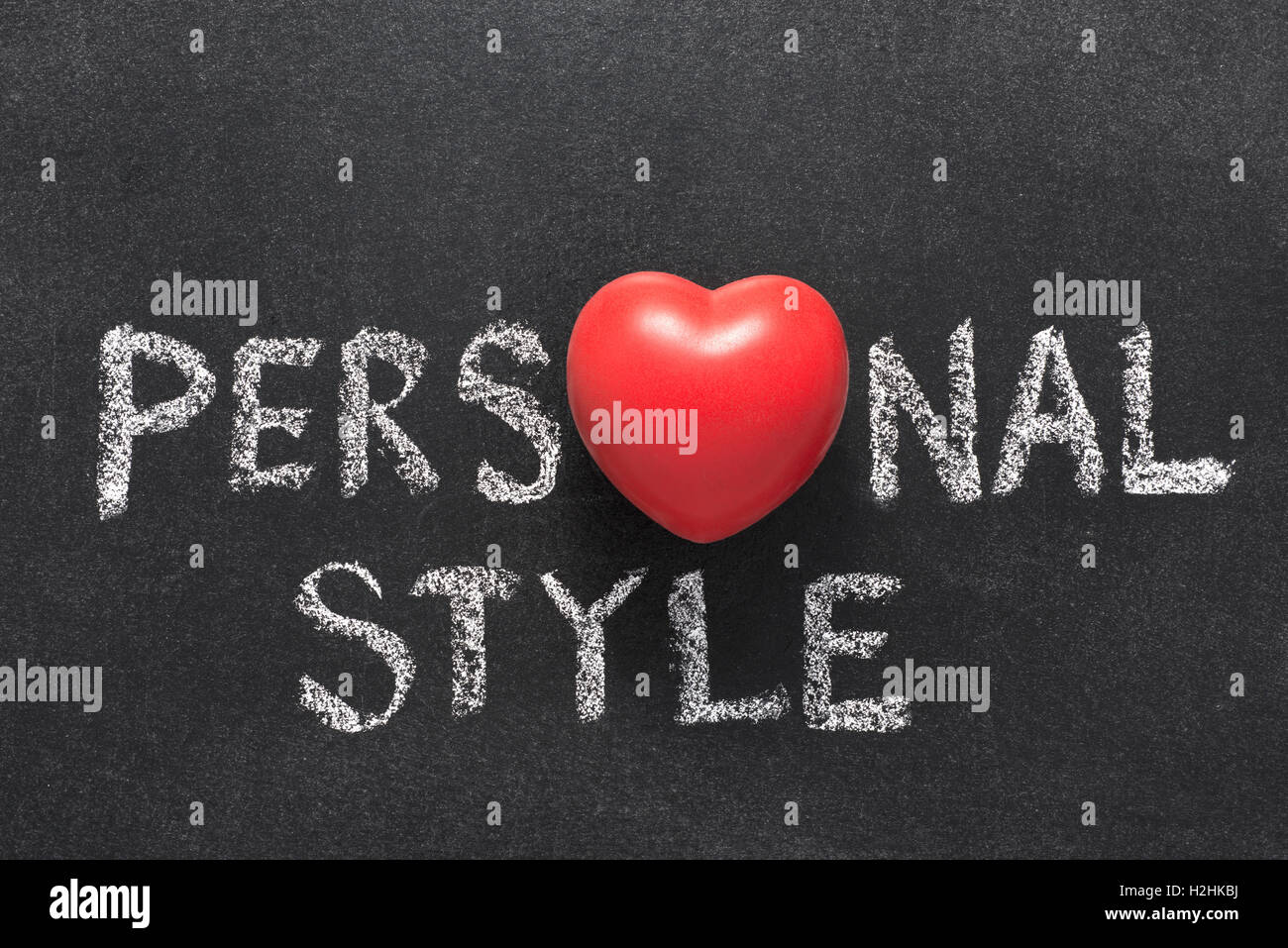 personal style phrase handwritten on blackboard with heart symbol instead of O Stock Photo