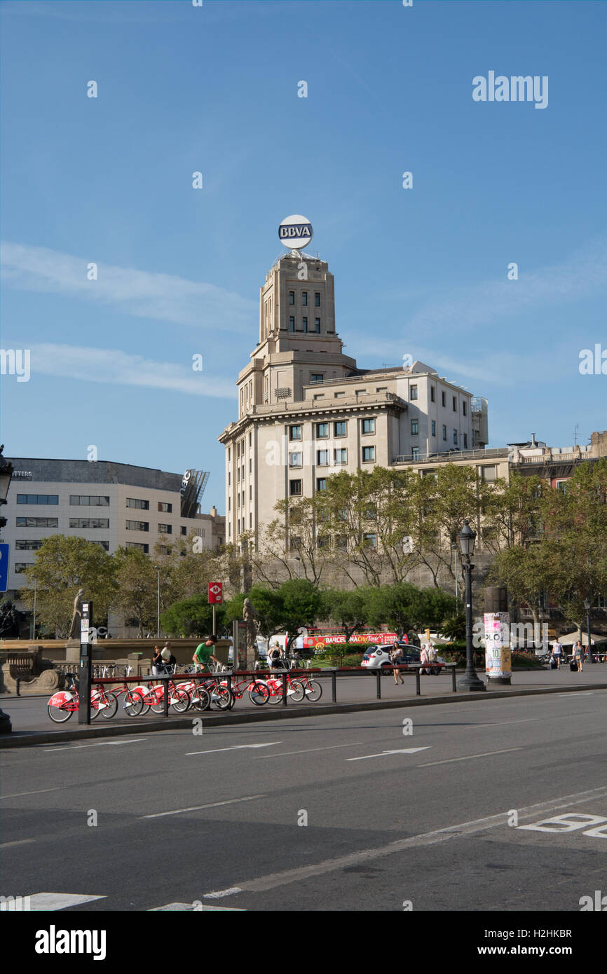 a view across Plaça de Catalunya Barcelona with a bicycle hire rack in the foreground Stock Photo