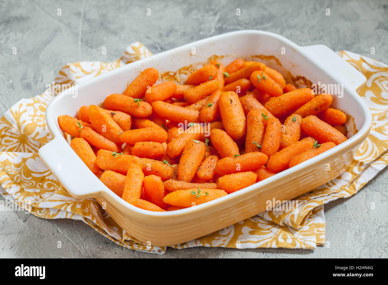 Honey Glazed Baby Carrots With Thyme and Nuts Stock Photo Alamy