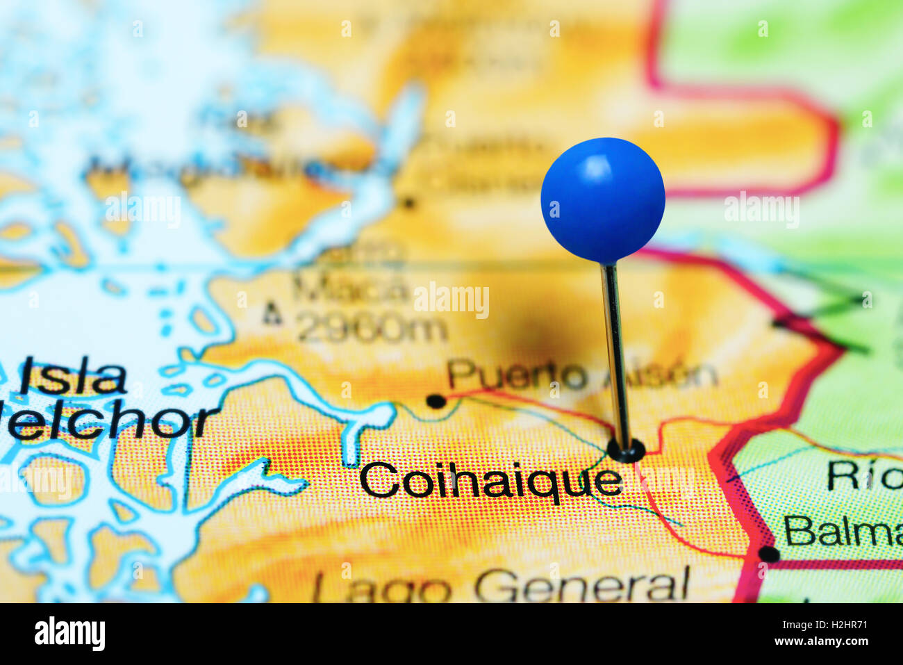Coihaique pinned on a map of Chile Stock Photo